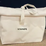 Rolled pouch in recycled cotton