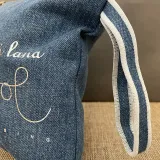 Denim jeans fabric pouch with handle detail