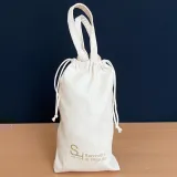 Sacchetto en coton naturel avec fermeture à cordons et poignées