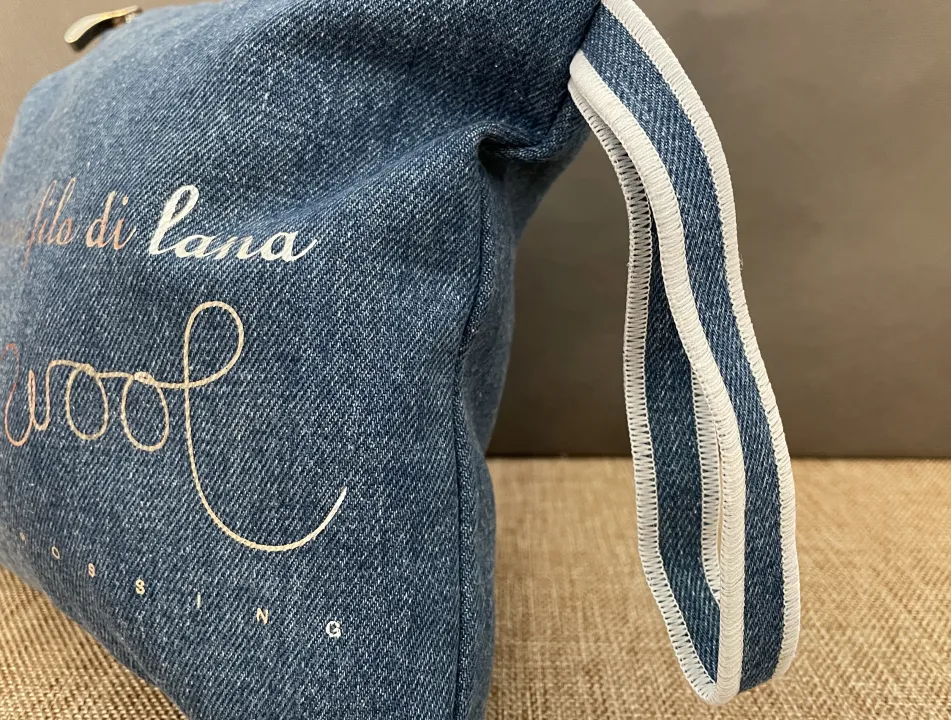 Denim jeans fabric pouch with handle detail