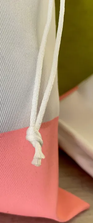 drawstring closure detail with rat tail cords