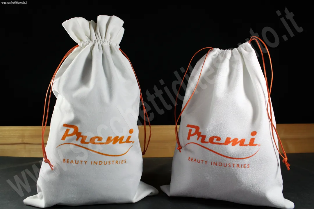 Sacchet en tissu velours et alcantara blanc avec fermeture en forme de bonbon pour cosmétiques et accessoires mode