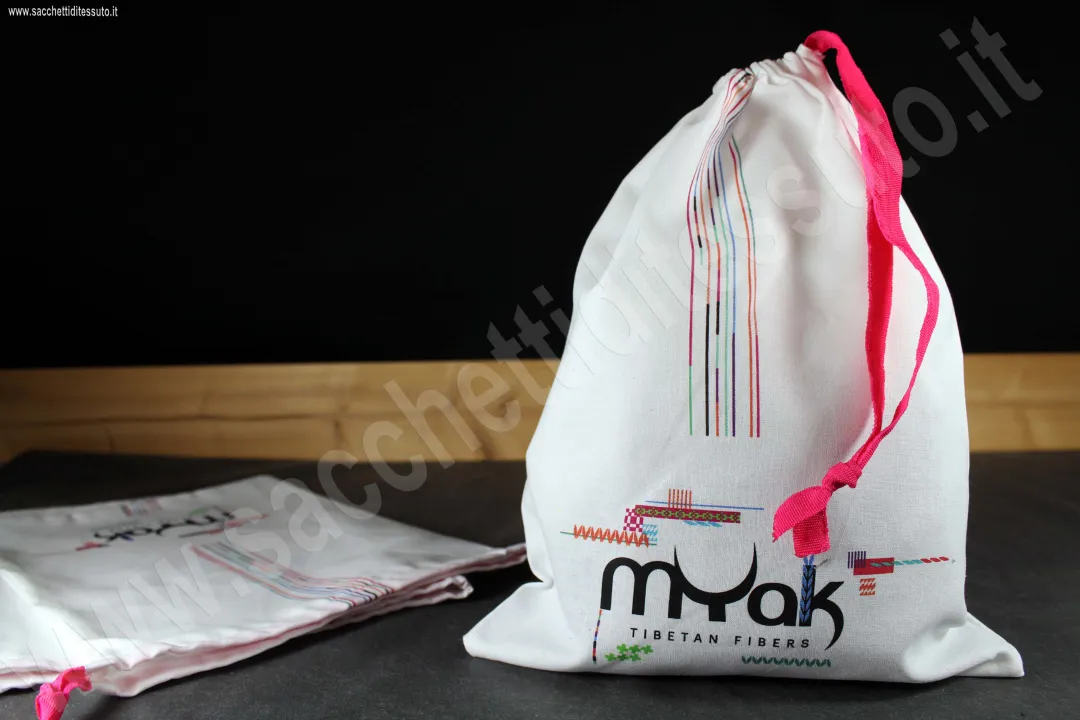 Sac en coton blanc optique avec fermeture par ruban en gros-grain