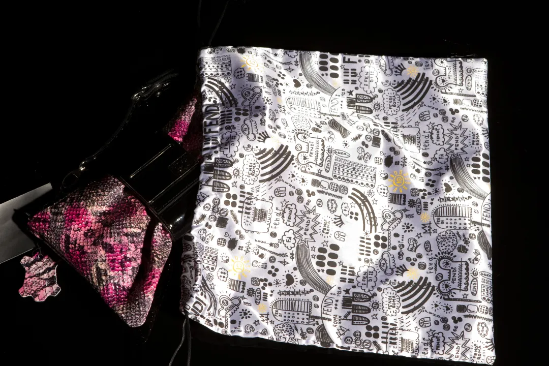 Silver satin pouch for leather goods